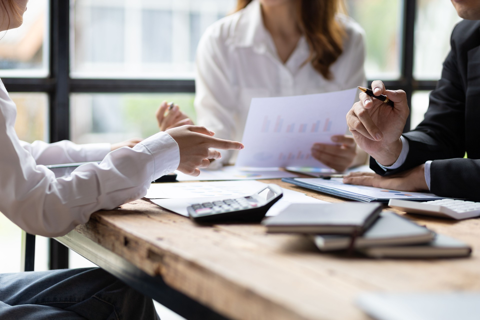 Business Strategy Analysis and Investment Planning Discussion. Businesspeople meeting with colleagues, brainstorming, planning new business projects and corporate collaboration.